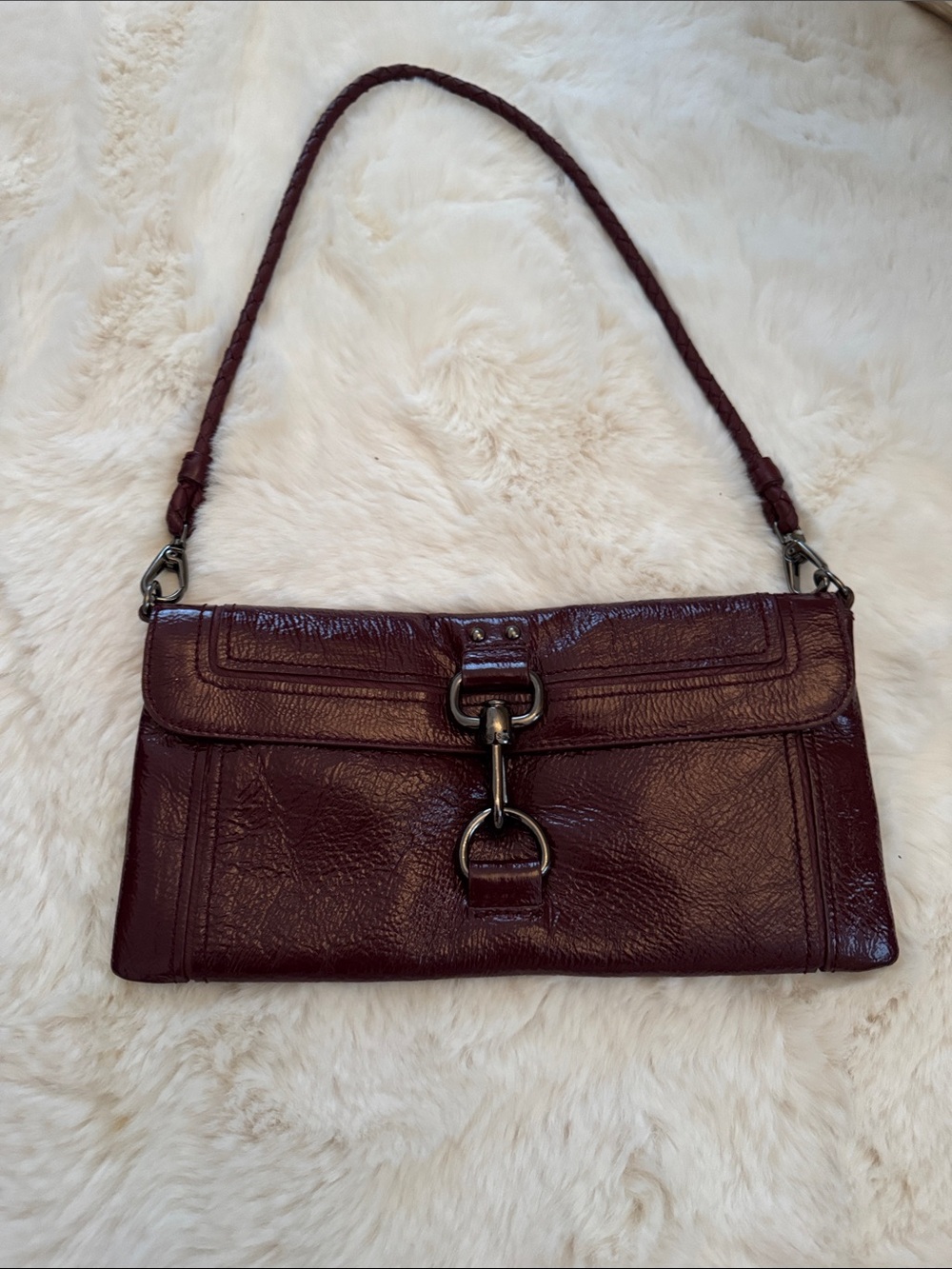 The Sak vintage Women's Burgundy patent Leather Shoulder Bag with Metal Hardware